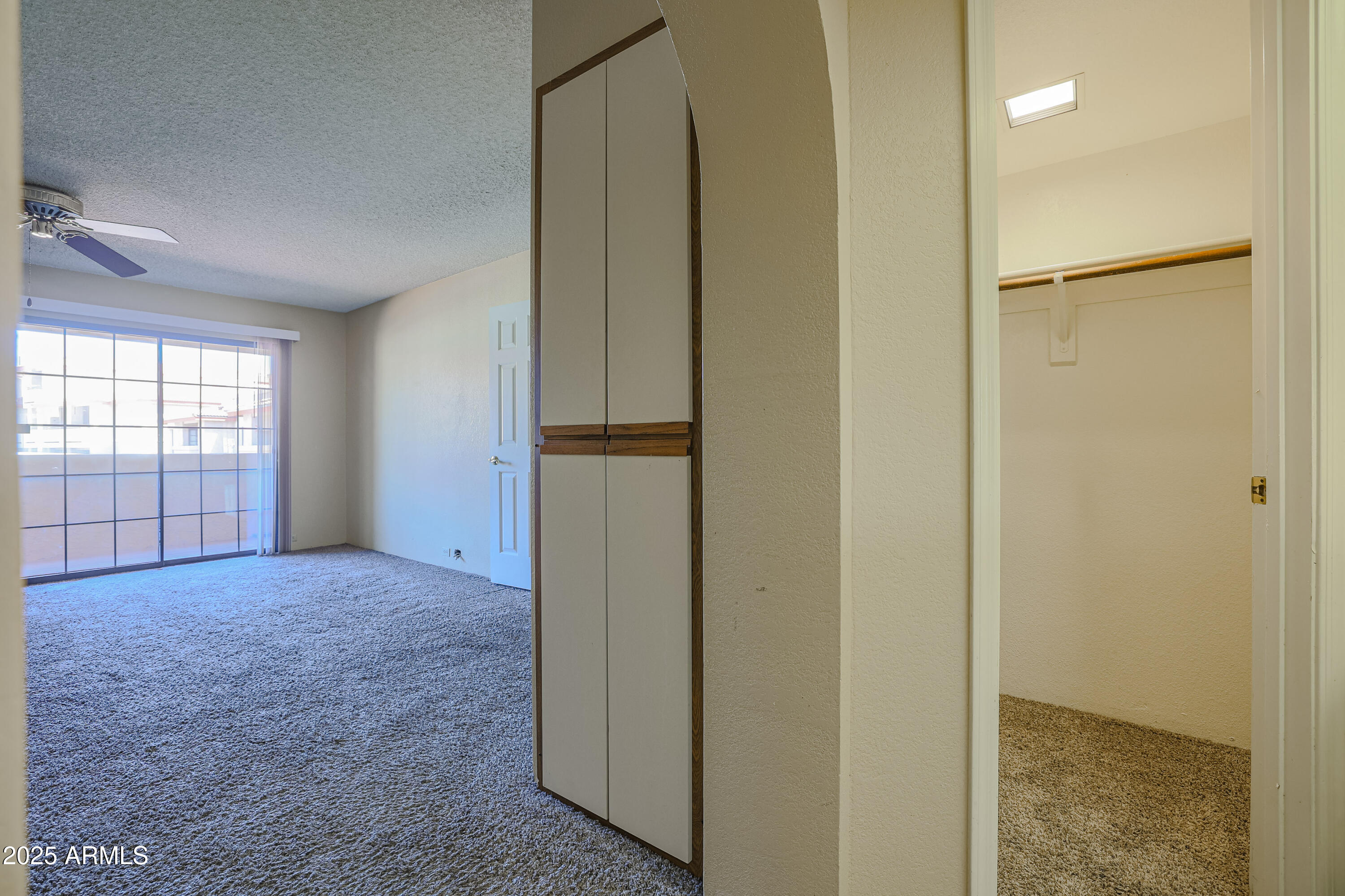 10410 North Cave Creek Road, Unit 2220 Phoenix, AZ 85020 - Photo 16 of 33 an empty room with windows and closet