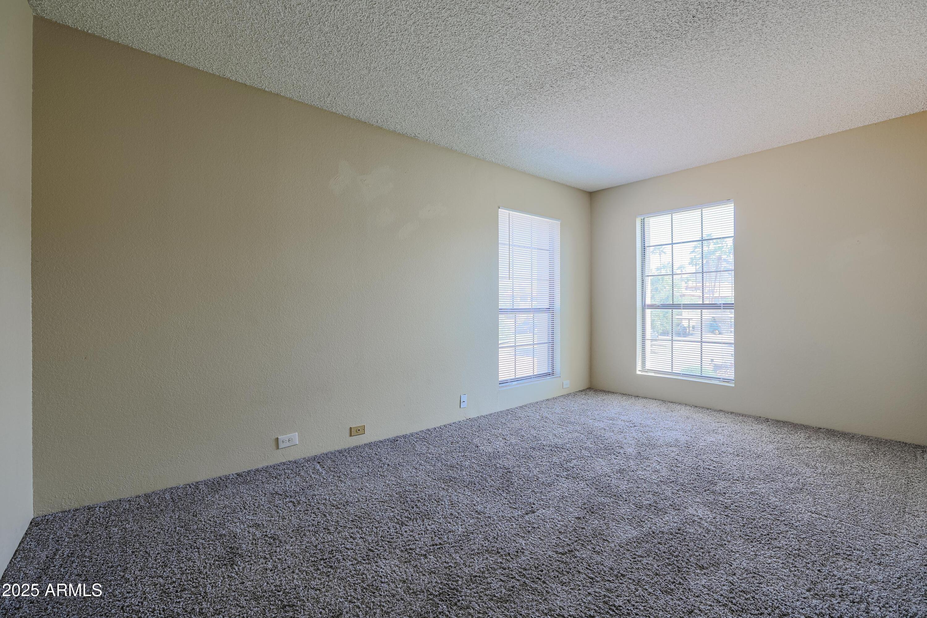 10410 North Cave Creek Road, Unit 2220 Phoenix, AZ 85020 - Photo 17 of 33 an empty room with windows