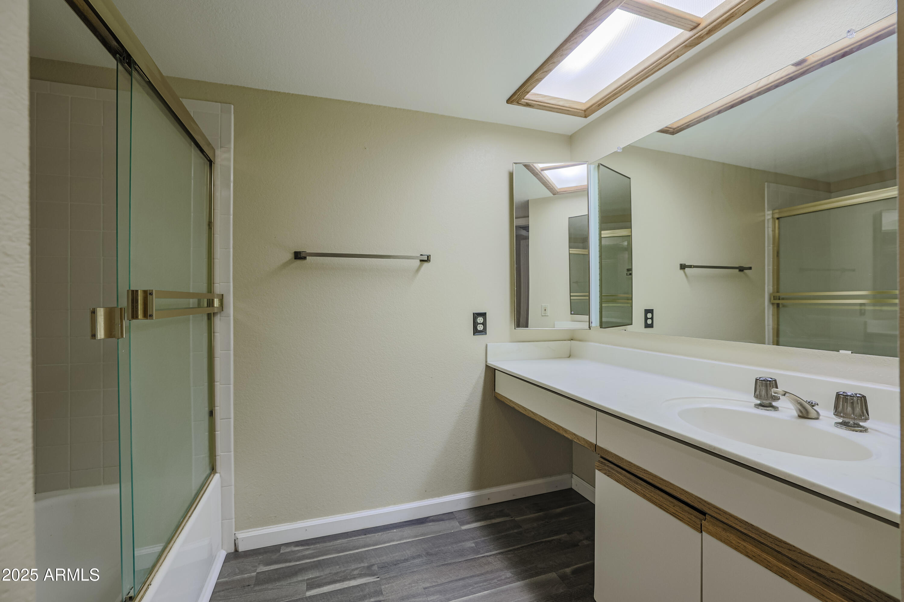 10410 North Cave Creek Road, Unit 2220 Phoenix, AZ 85020 - Photo 21 of 33 a bathroom with a sink and a mirror