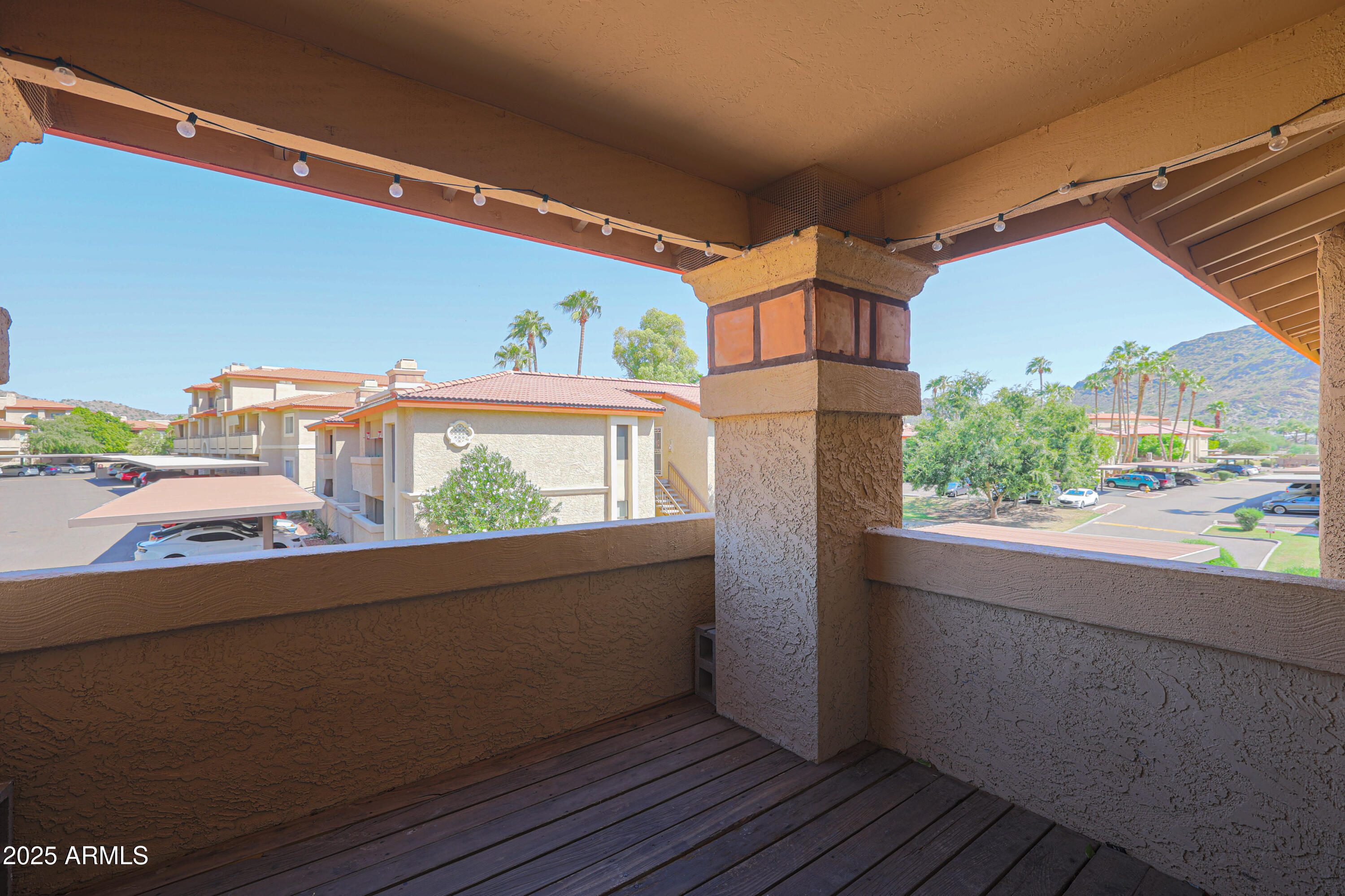 10410 North Cave Creek Road, Unit 2220 Phoenix, AZ 85020 - Photo 25 of 33 a view of a balcony and front view of a house