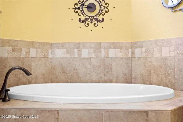 a bathroom with a granite countertop sink toilet a mirror and shower