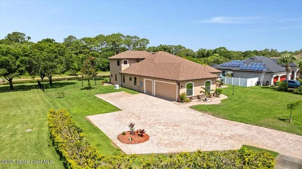 a view of a house with garden