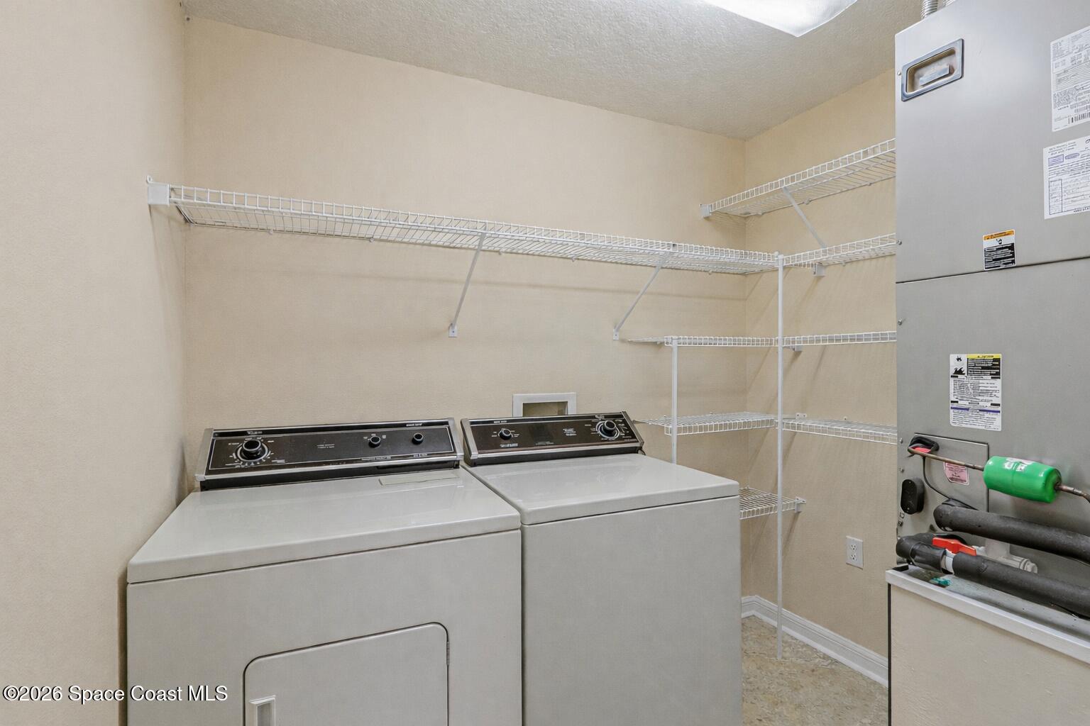 934 South Fork Circle Melbourne, FL 32901 - Photo 12 of 60 a utility room with dryer and washer