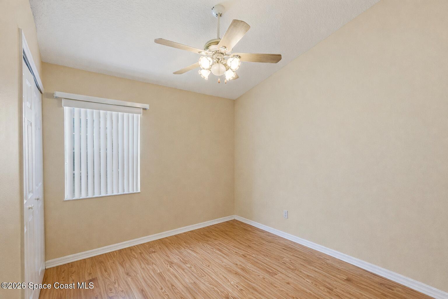 934 South Fork Circle Melbourne, FL 32901 - Photo 19 of 60 wooden floor in an empty room with a window