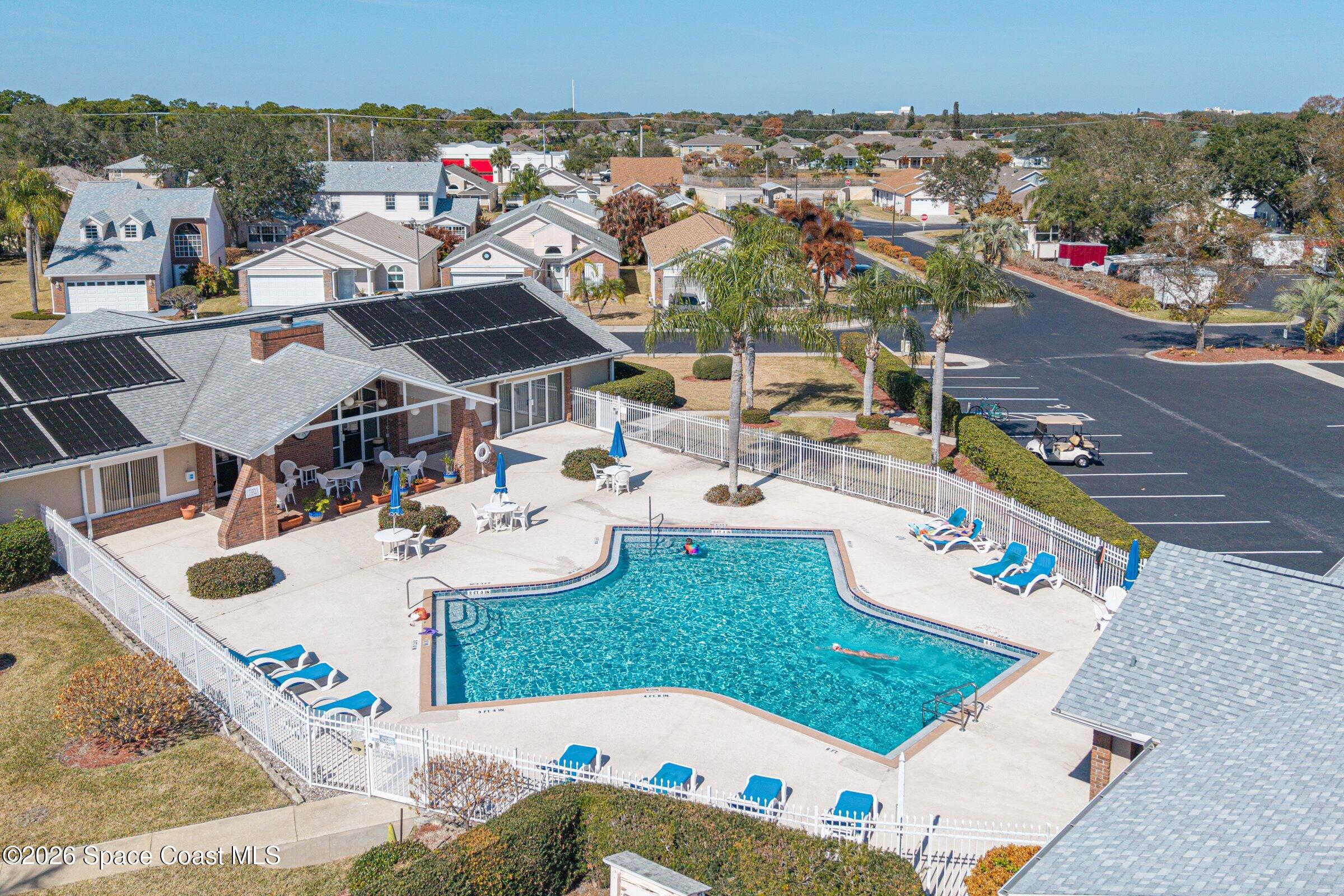 934 South Fork Circle Melbourne, FL 32901 - Photo 58 of 60 swimming pool view with couple of cars parked