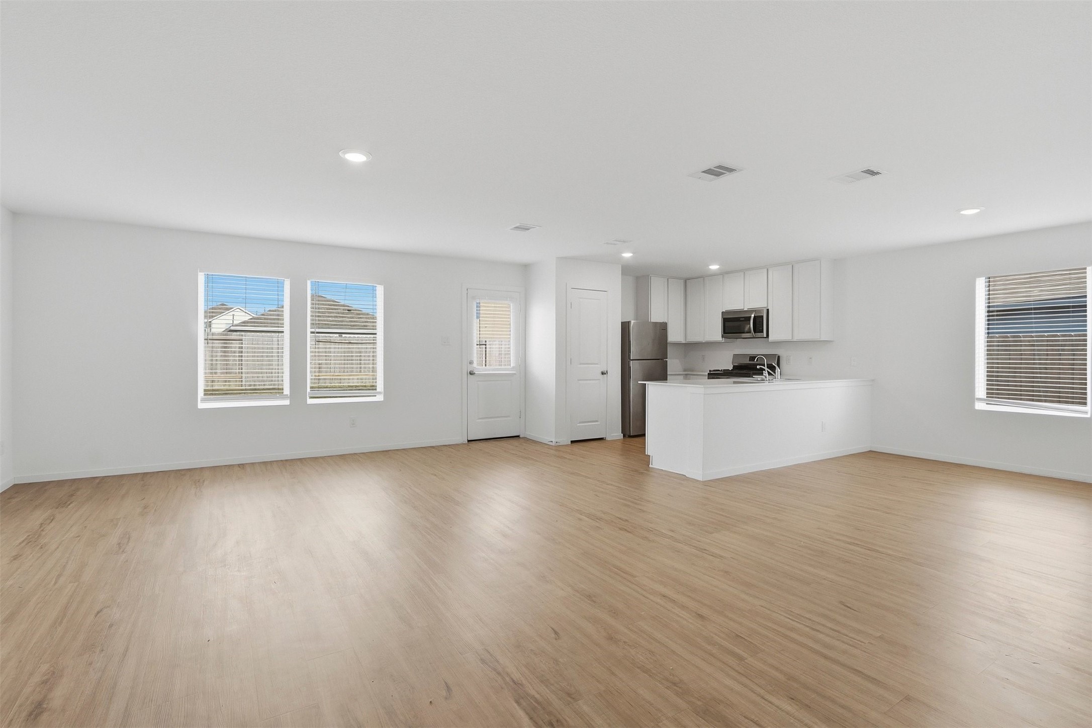 21006 Longwitton Lane Humble, TX 77338 - Photo 5 of 25 a view of a livingroom with furniture wooden floor and windows