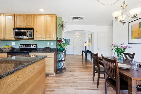 a view of a kitchen and dining table