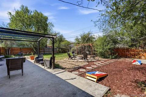 a view of a backyard with sitting area