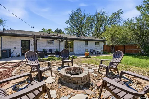 a front view of house with a garden and patio