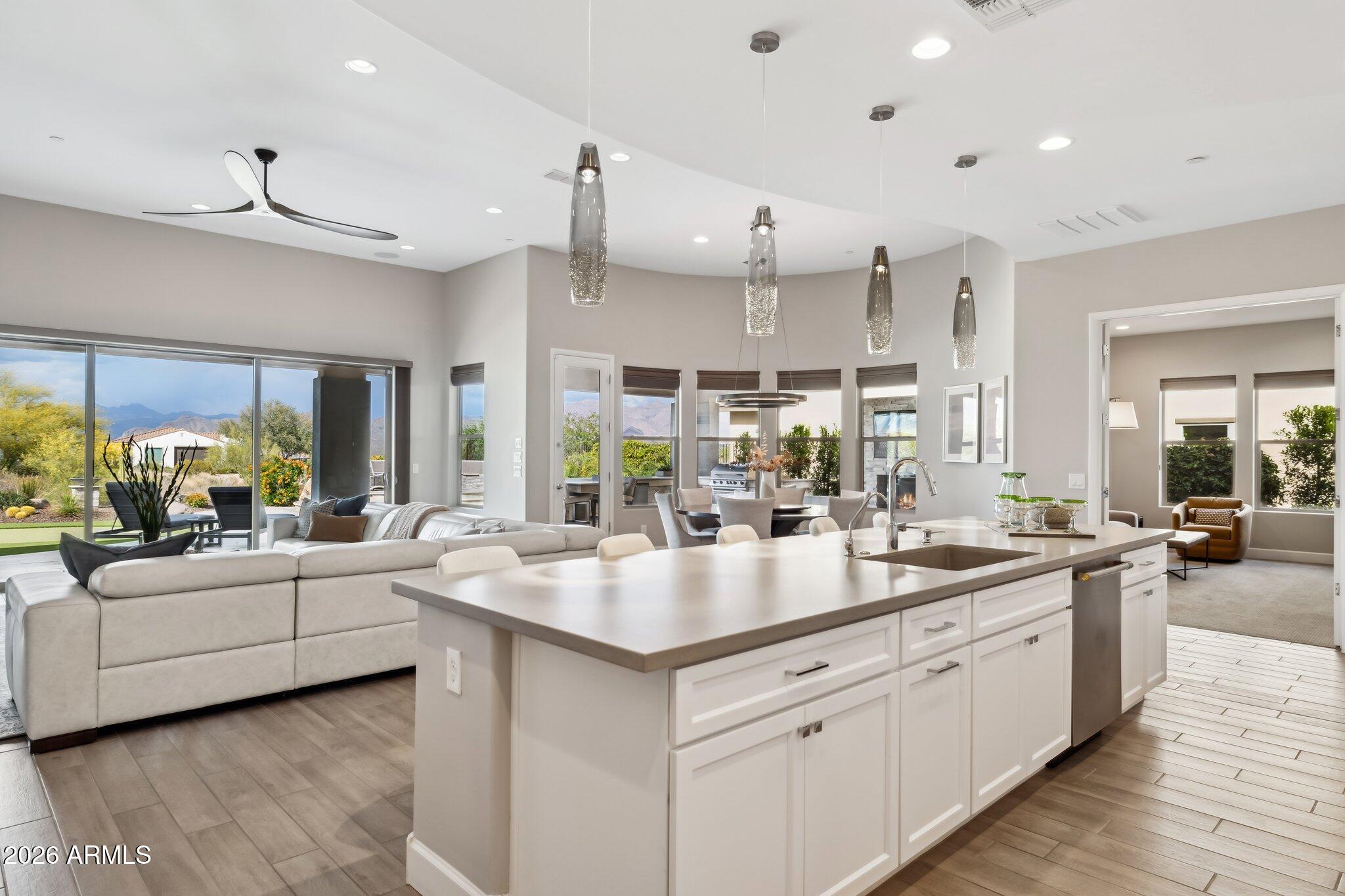 17964 East Wolf Tree Lane Rio Verde, AZ 85263 - Photo 15 of 101 a large white kitchen with a large window