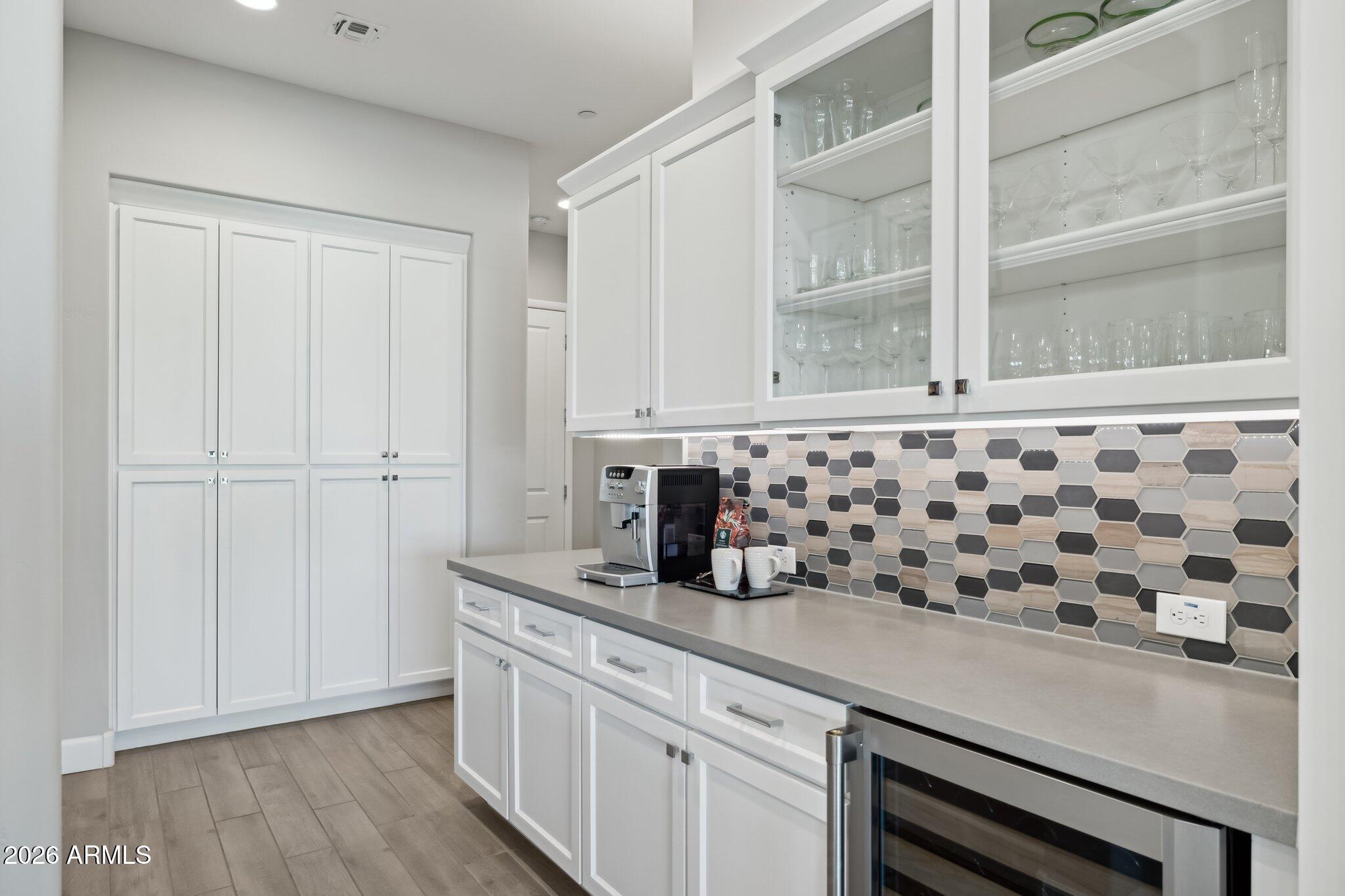 17964 East Wolf Tree Lane Rio Verde, AZ 85263 - Photo 16 of 101 a kitchen with a sink and cabinets
