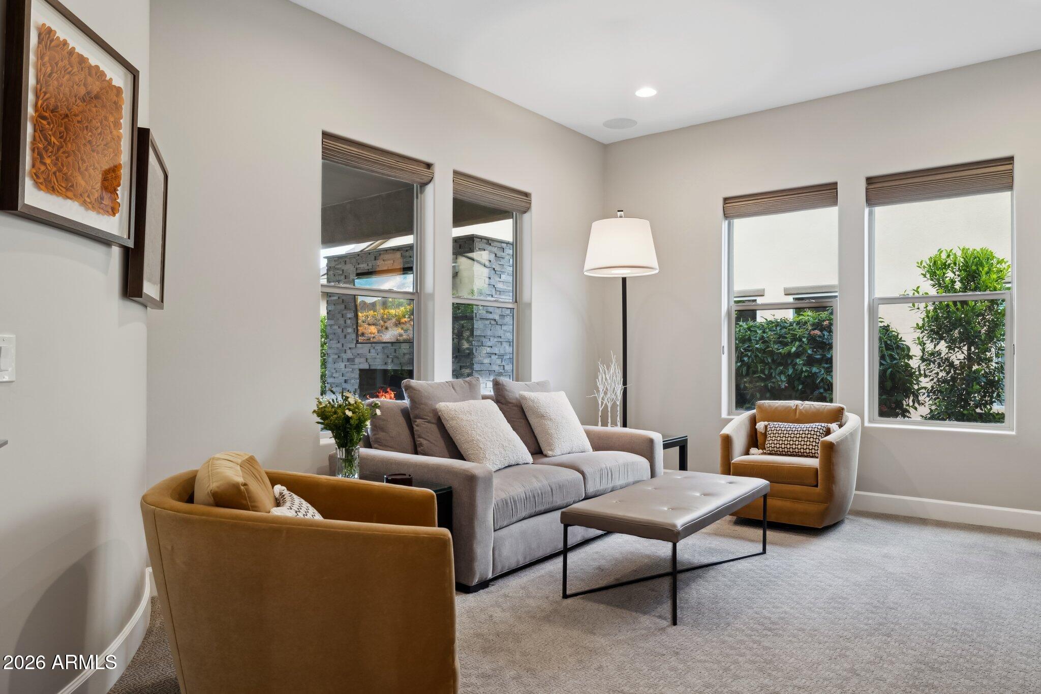17964 East Wolf Tree Lane Rio Verde, AZ 85263 - Photo 20 of 101 a living room with furniture and a large window
