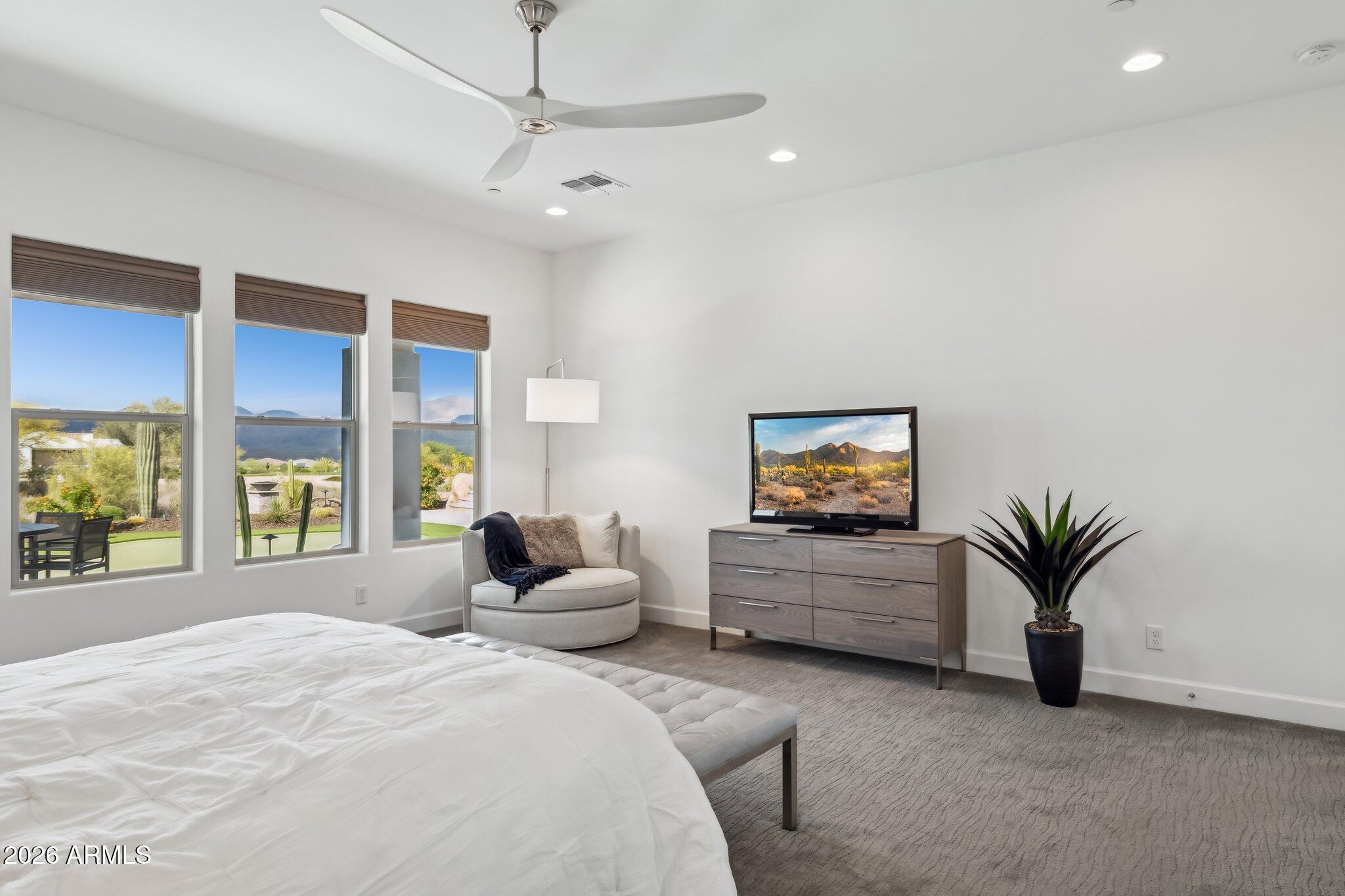17964 East Wolf Tree Lane Rio Verde, AZ 85263 - Photo 23 of 101 a bedroom with furniture and a large window