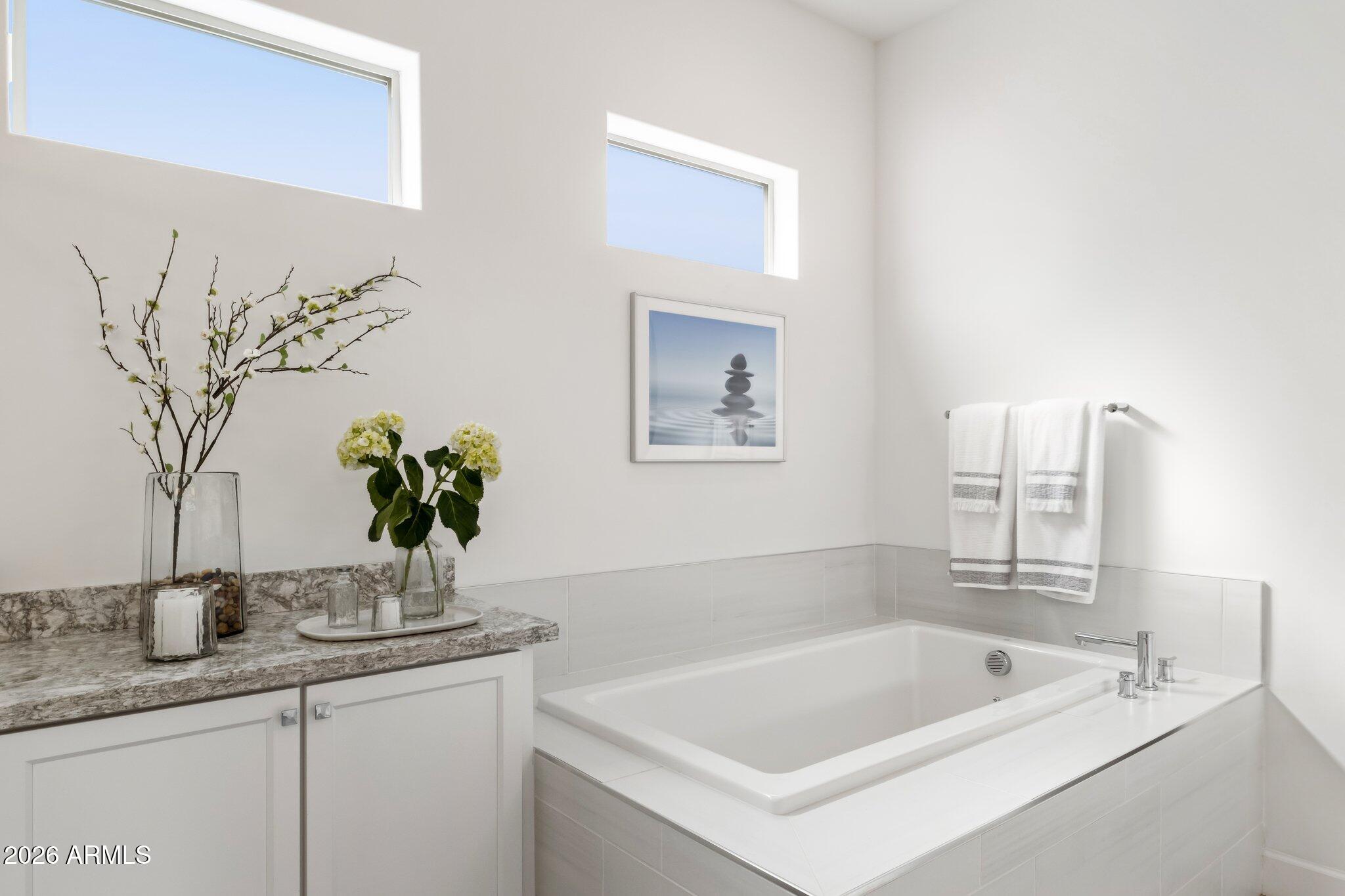 17964 East Wolf Tree Lane Rio Verde, AZ 85263 - Photo 25 of 101 a bath tub sitting next to a white sink