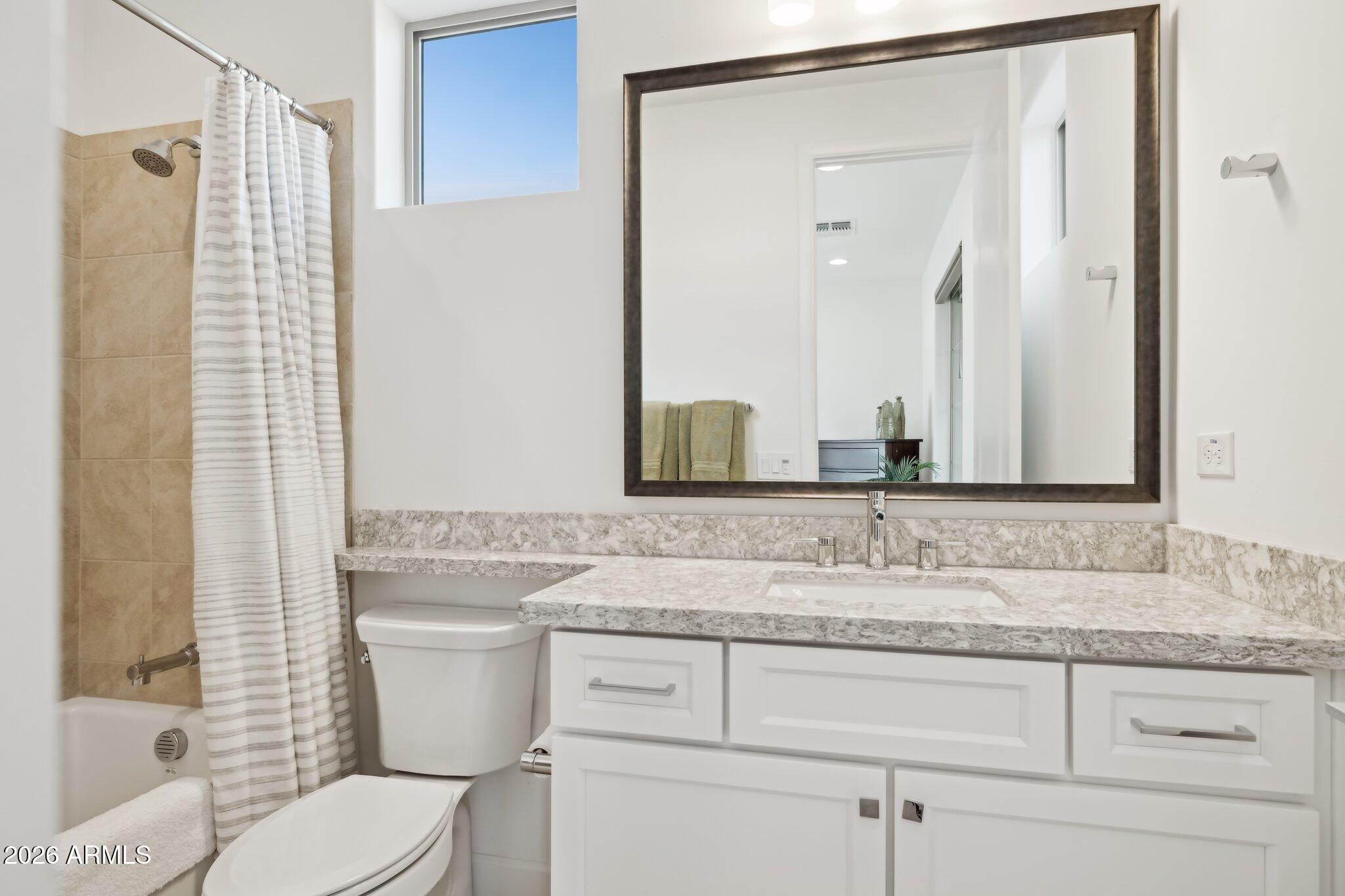 17964 East Wolf Tree Lane Rio Verde, AZ 85263 - Photo 37 of 101 a bathroom with a granite countertop sink toilet and shower