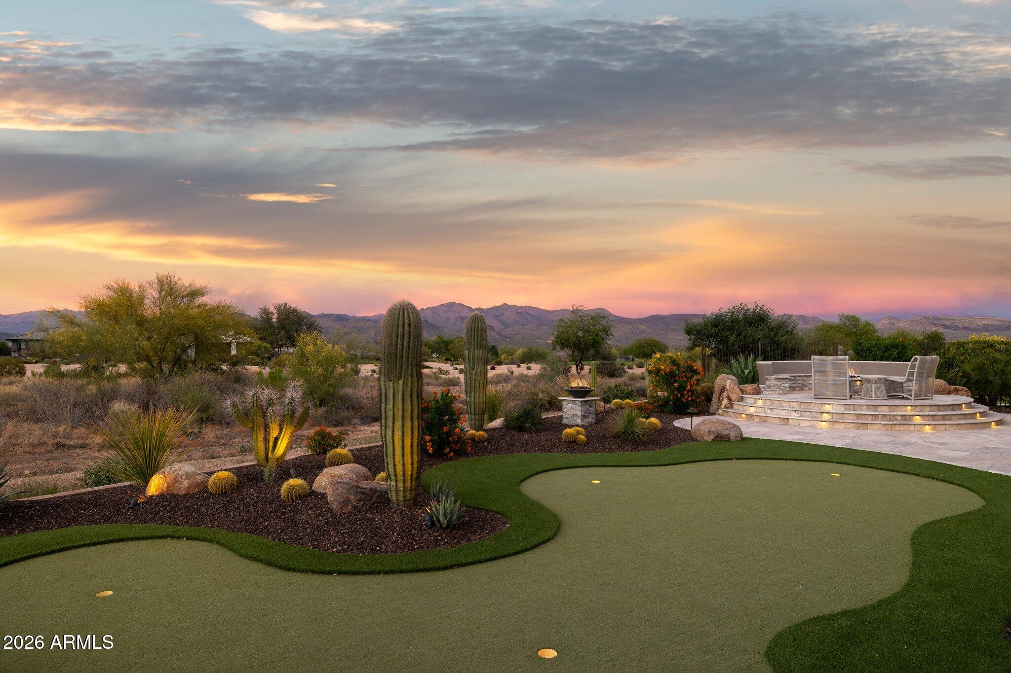 17964 East Wolf Tree Lane Rio Verde, AZ 85263 - Photo 58 of 101 a view of a lake with a yard