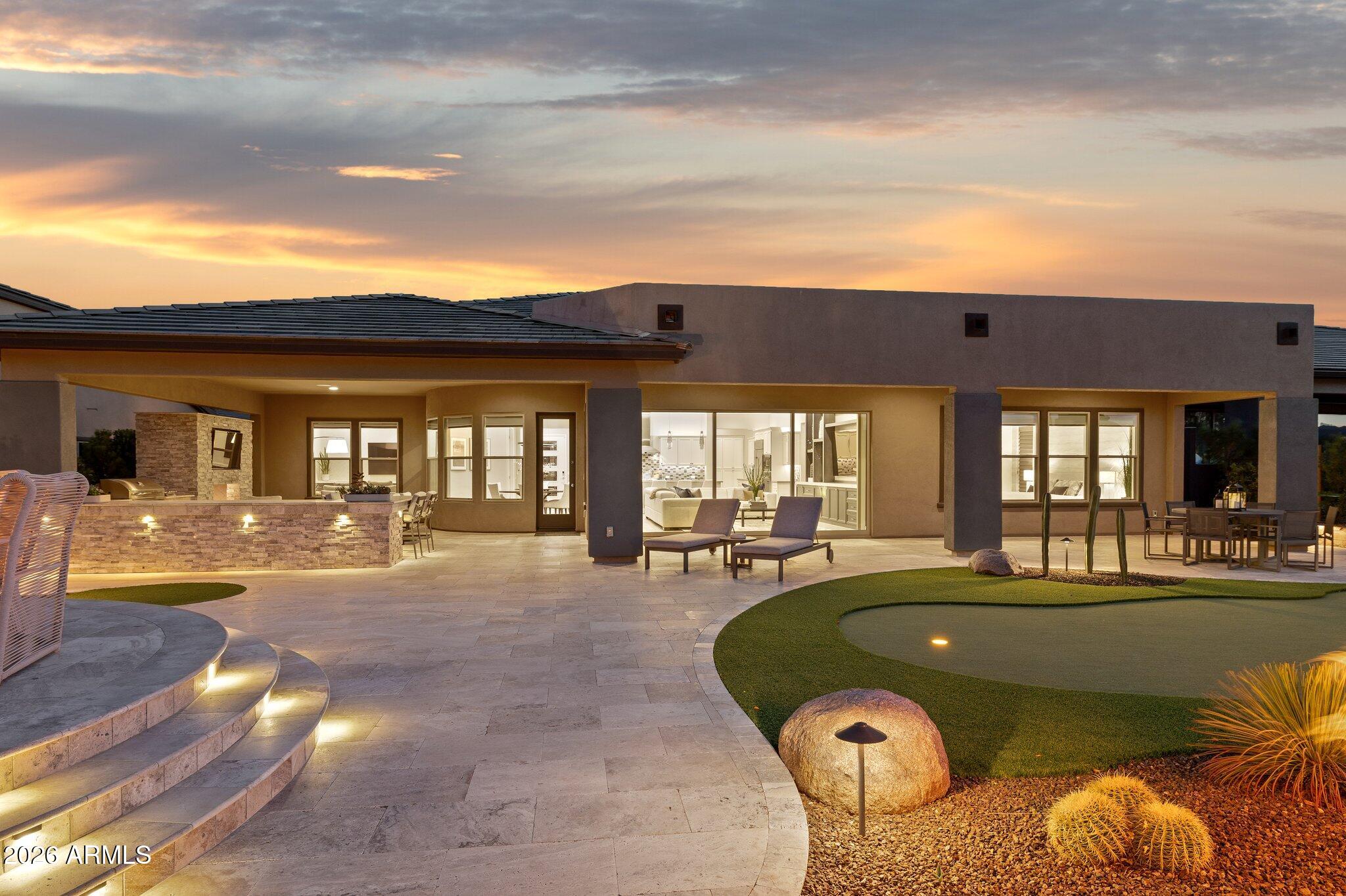 17964 East Wolf Tree Lane Rio Verde, AZ 85263 - Photo 60 of 101 a view of a house with swimming pool and sitting area