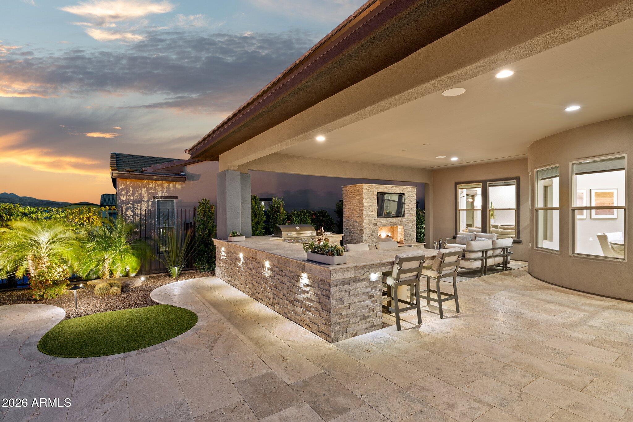 17964 East Wolf Tree Lane Rio Verde, AZ 85263 - Photo 62 of 101 a living room with furniture and a large window