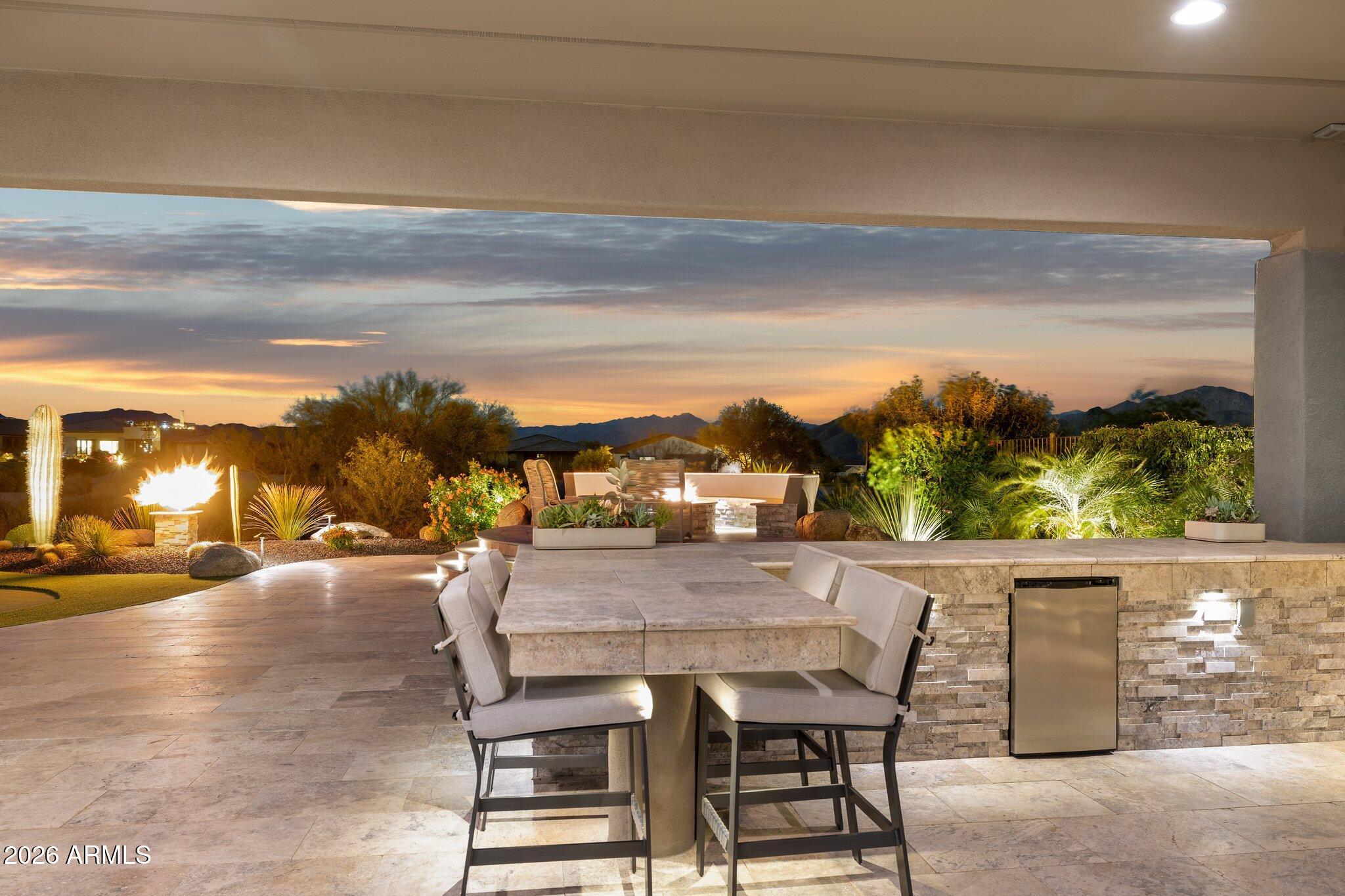 17964 East Wolf Tree Lane Rio Verde, AZ 85263 - Photo 64 of 101 a view of dinning table and chairs in the terrace
