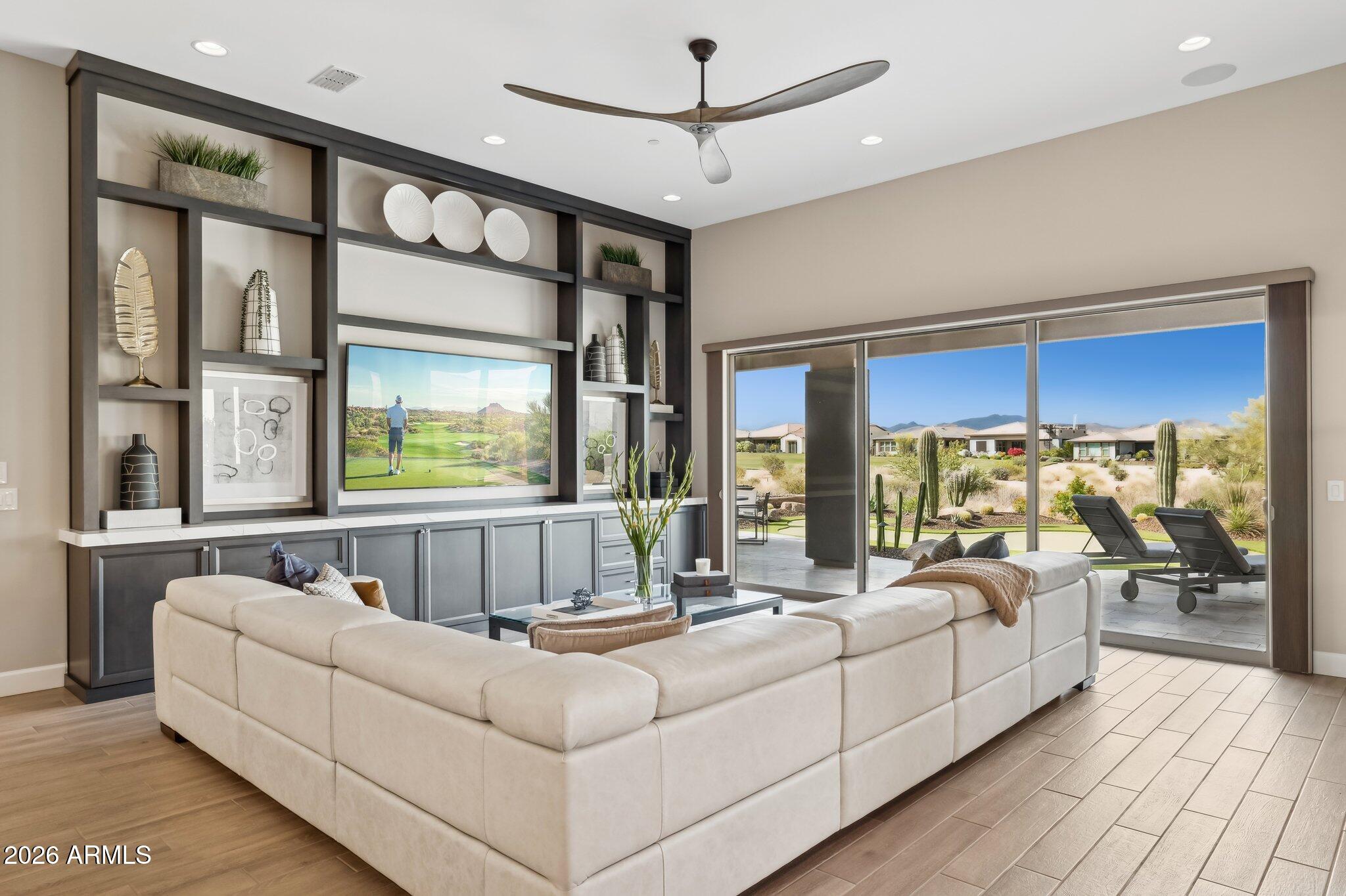 17964 East Wolf Tree Lane Rio Verde, AZ 85263 - Photo 7 of 101 a living room with furniture large window and a chandelier