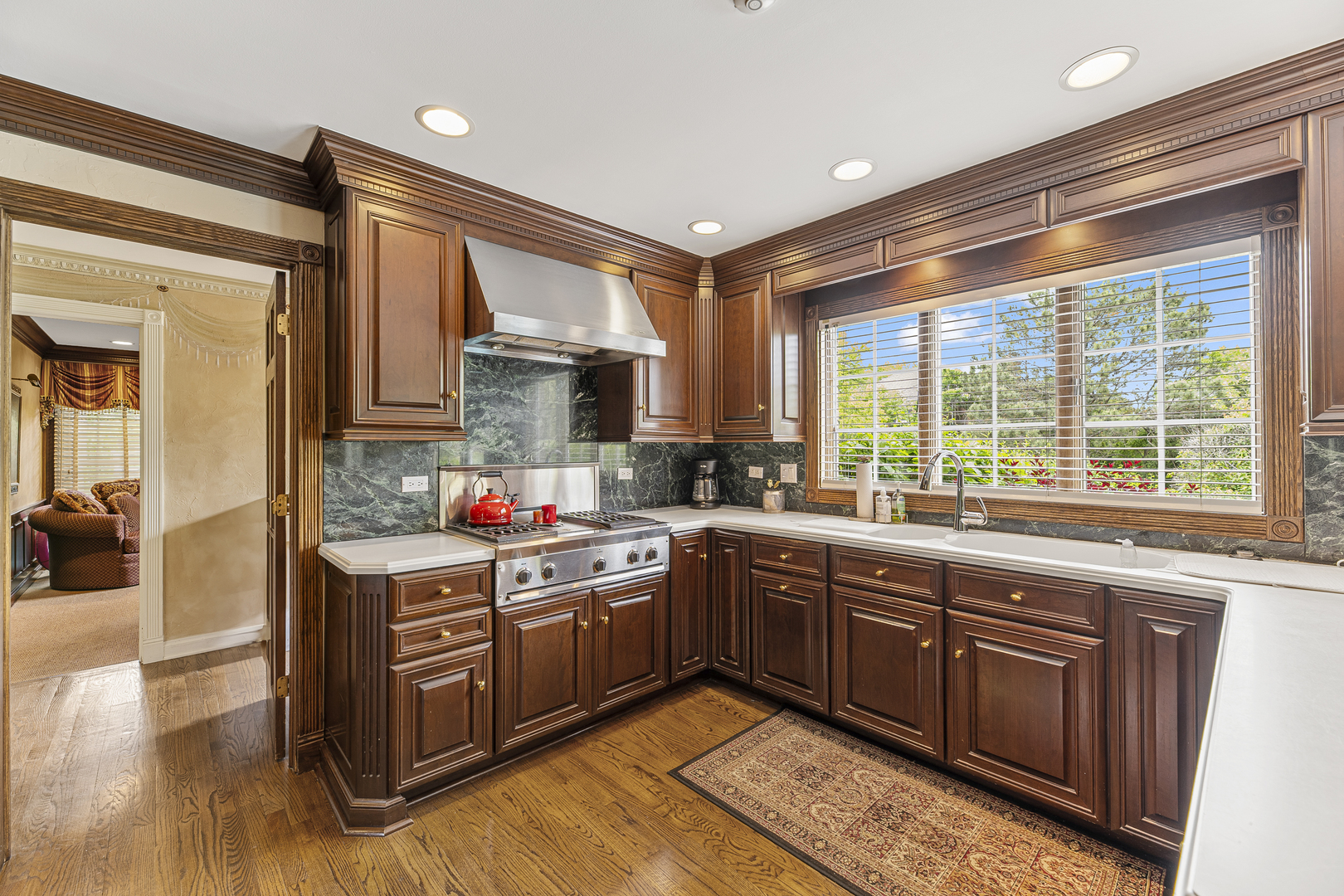 2308 Indian Ridge Drive Glenview, IL 60026 - Photo 11 of 60 a kitchen with stainless steel appliances granite countertop a stove a sink dishwasher and a microwave oven with cabinets