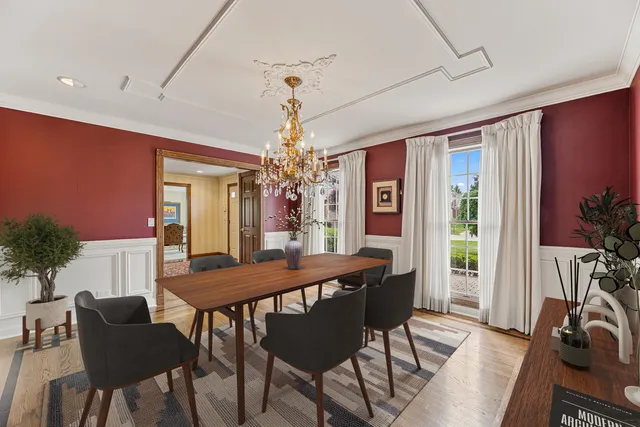 a living room with furniture a rug and a large window