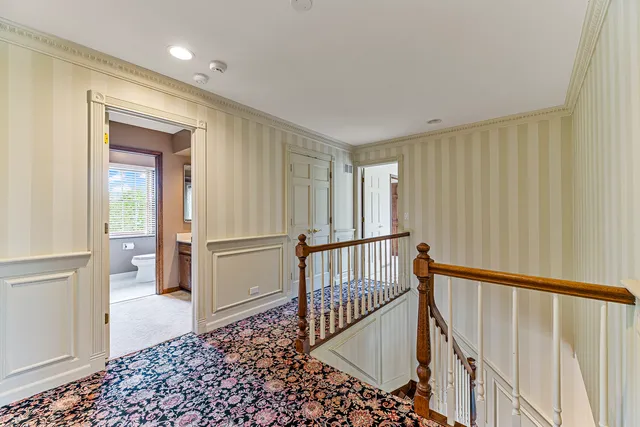 a spacious bedroom with a large bed and windows