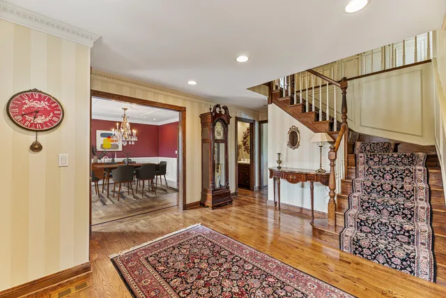 a view of staircase with furniture and a rug