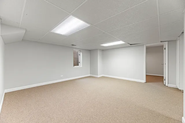 a view of a livingroom with table and chair