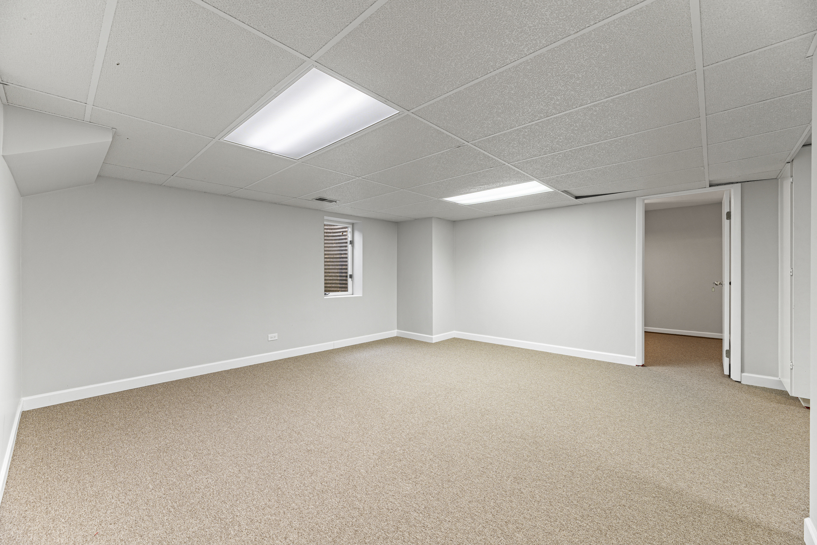 2308 Indian Ridge Drive Glenview, IL 60026 - Photo 36 of 60 an empty room with a empty space and windows