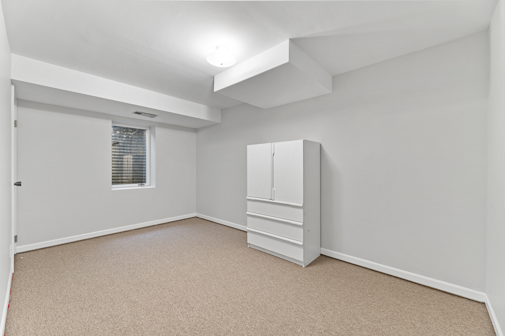 2308 Indian Ridge Drive Glenview, IL 60026 - Photo 37 of 60 an empty room with a white cabinet and mirror