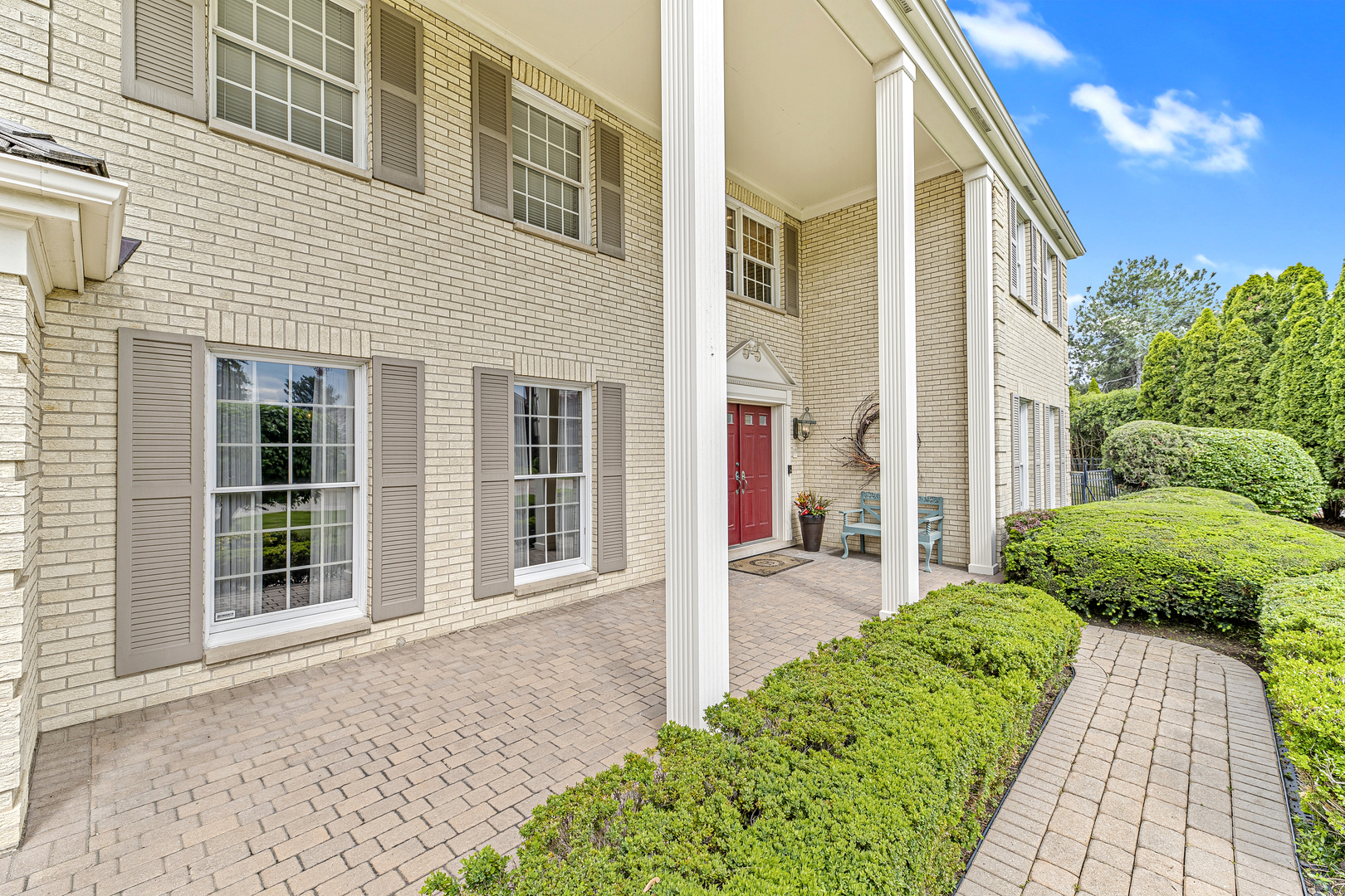 2308 Indian Ridge Drive Glenview, IL 60026 - Photo 44 of 60 a front view of a house with a yard and potted plants