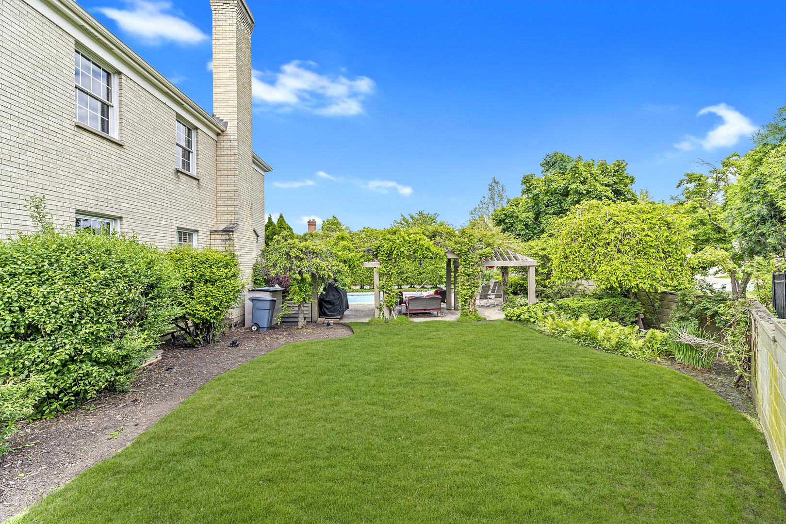 2308 Indian Ridge Drive Glenview, IL 60026 - Photo 53 of 60 a view of a garden with a building in the background