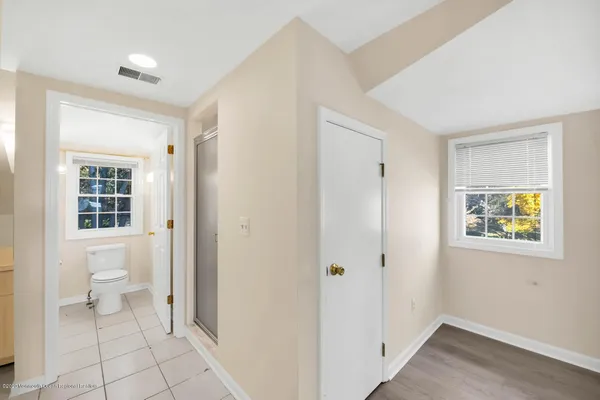 a bathroom with a toilet a sink and shower