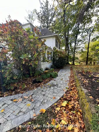 a view of a pathway of a house with wooden stairs