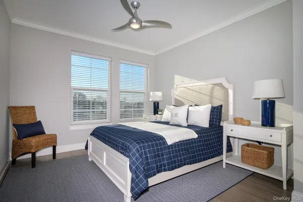 a bedroom with a bed and a chair