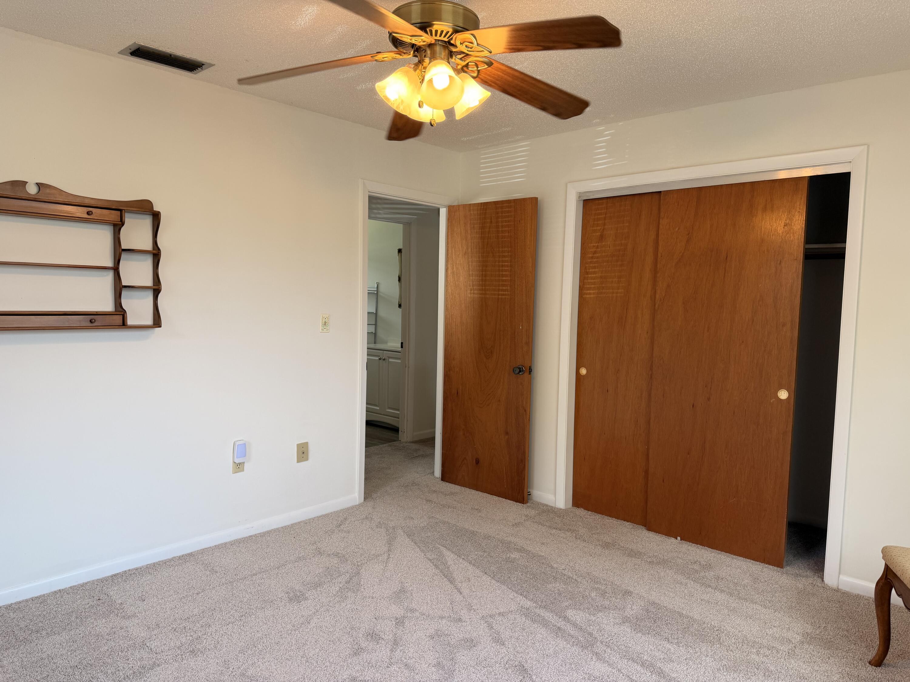 3283 Southwest 20th Street Okeechobee, FL 34974 - Photo 11 of 19 a view of empty room with window and ceiling fan