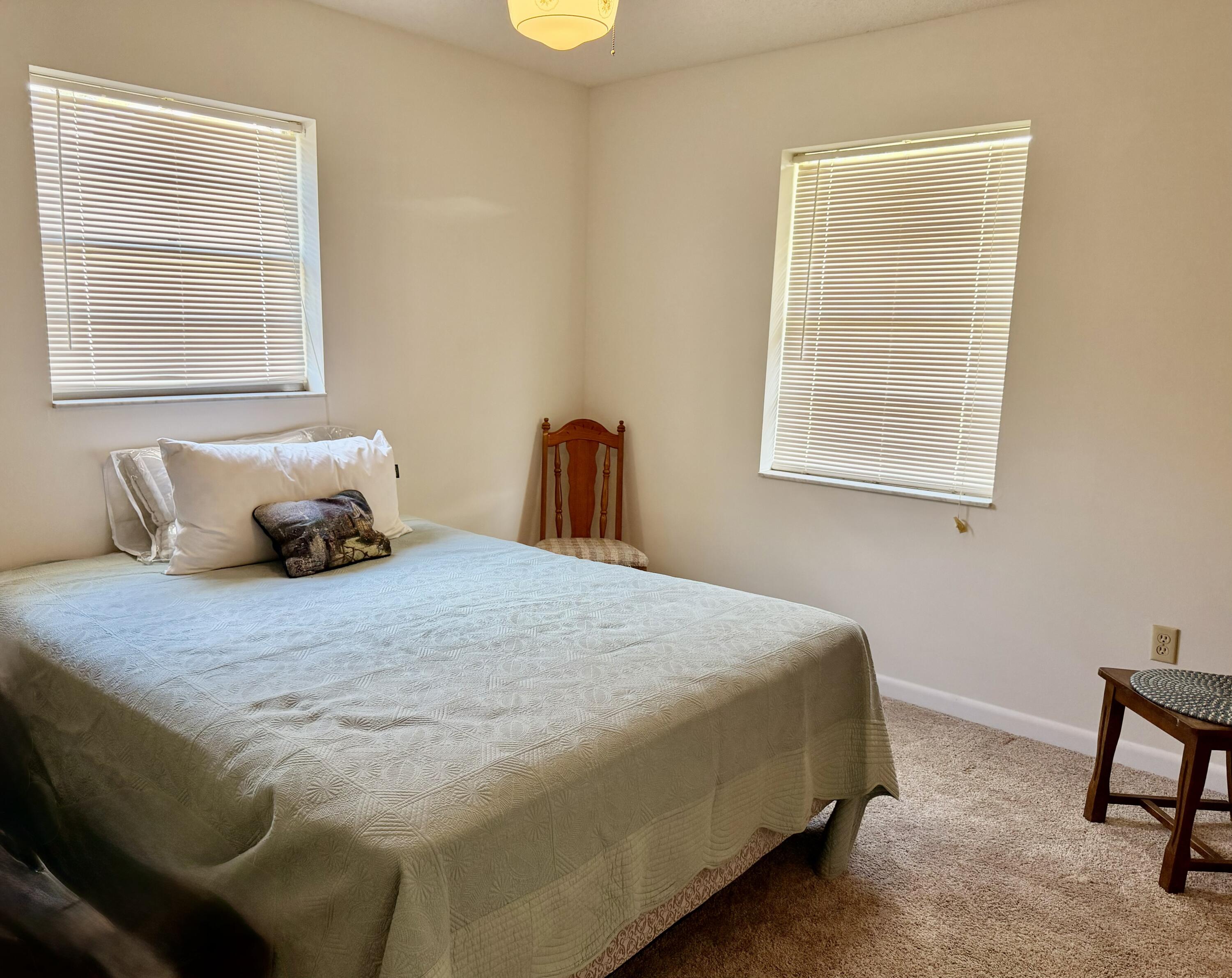 3283 Southwest 20th Street Okeechobee, FL 34974 - Photo 13 of 19 a bedroom with a bed and window