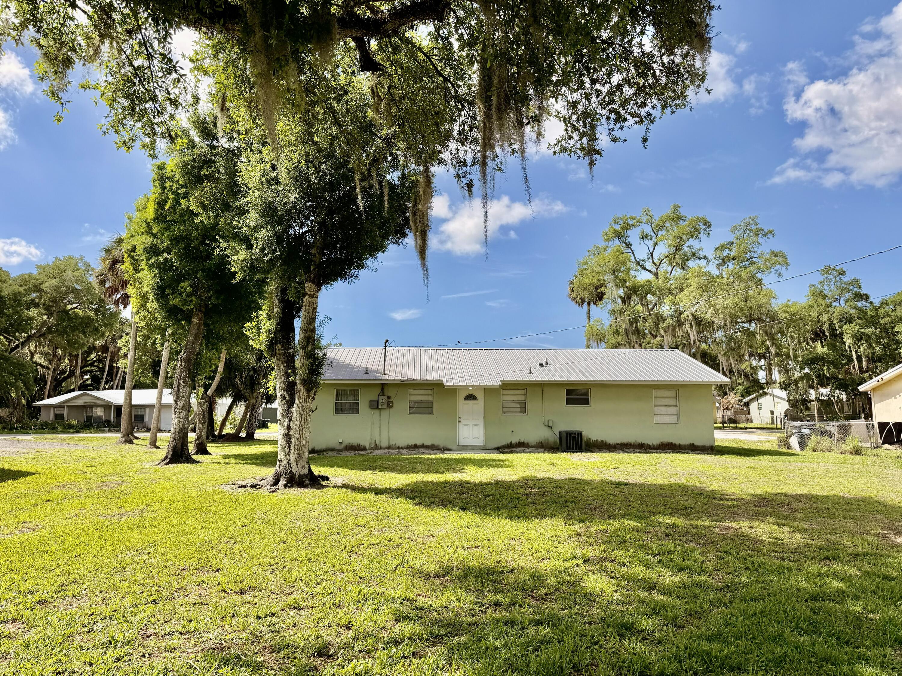 3283 Southwest 20th Street Okeechobee, FL 34974 - Photo 19 of 19 a view of a swimming pool with an outdoor space and seating area