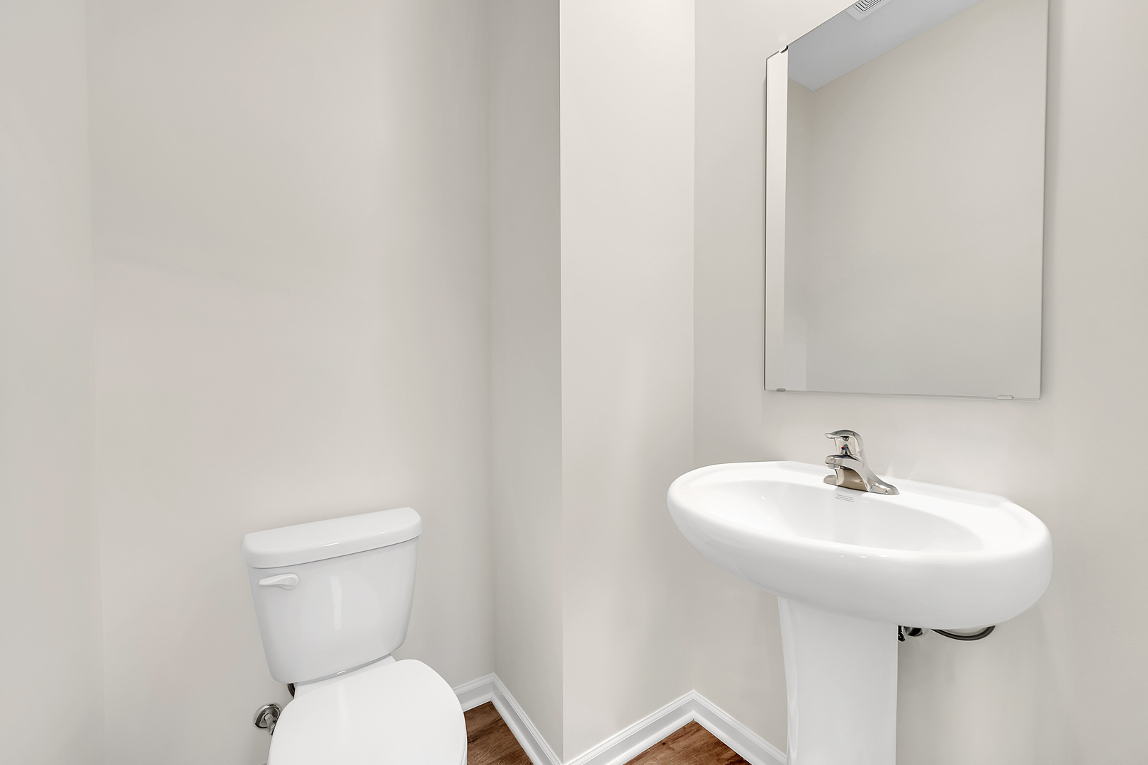 6720 Applegate Drive Plainfield, IL 60586 - Photo 12 of 17 a bathroom with a toilet sink and mirror
