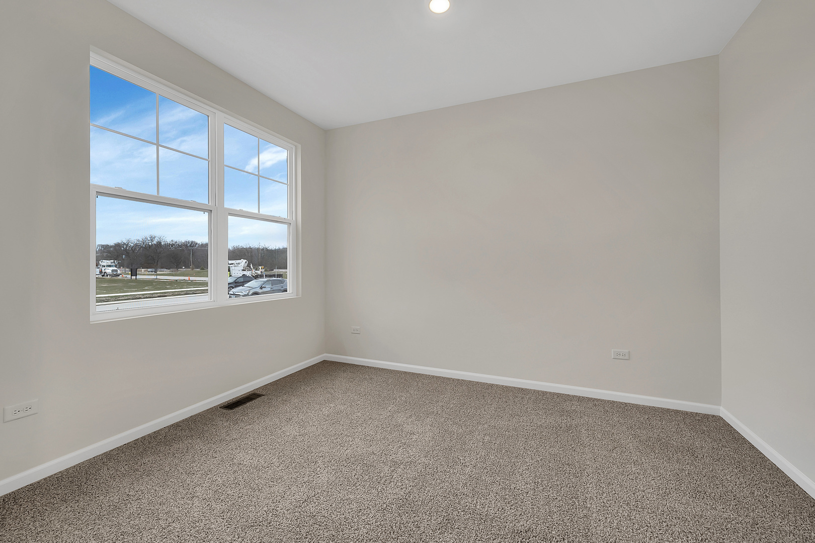 6720 Applegate Drive Plainfield, IL 60586 - Photo 5 of 17 an empty room with a window