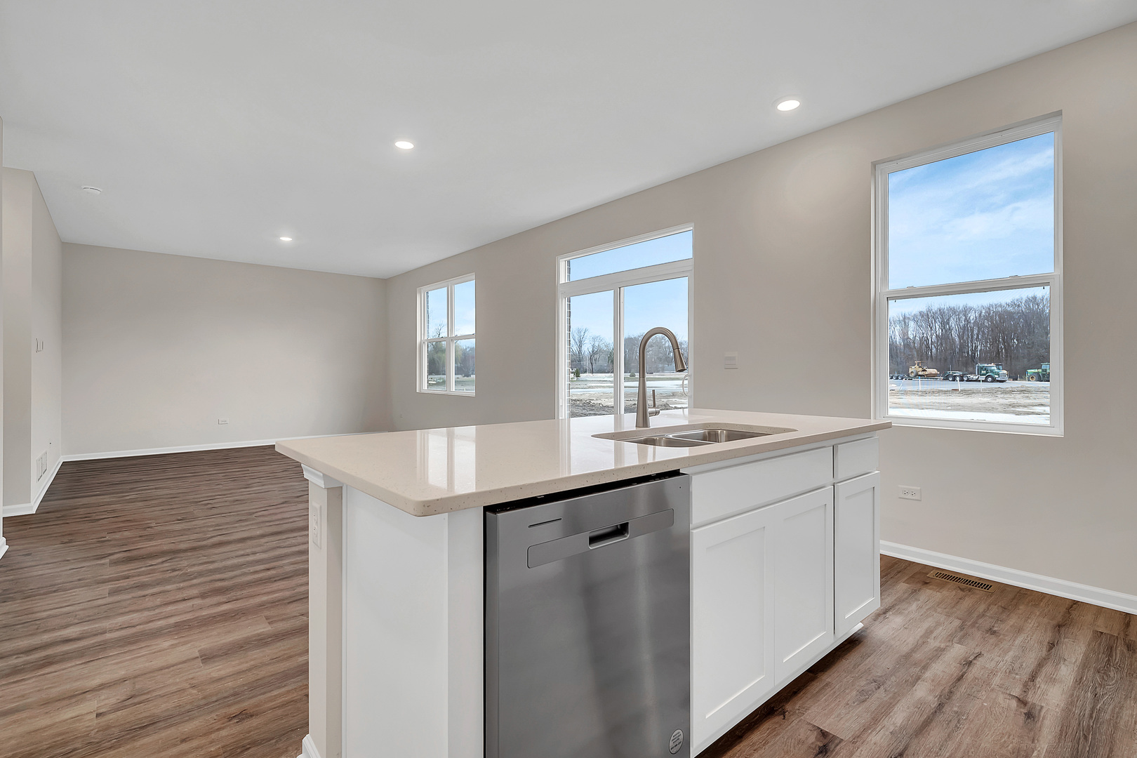 6720 Applegate Drive Plainfield, IL 60586 - Photo 10 of 17 a kitchen with a sink cabinets and wooden floor