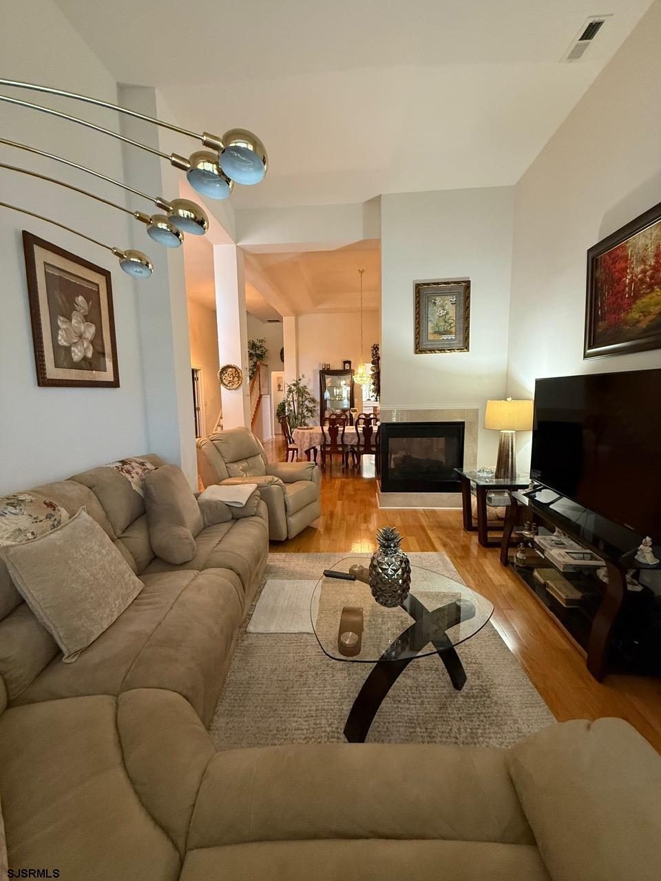 36 West Delray Lane Absecon, NJ 08201 - Photo 11 of 23 a living room with furniture and a flat screen tv