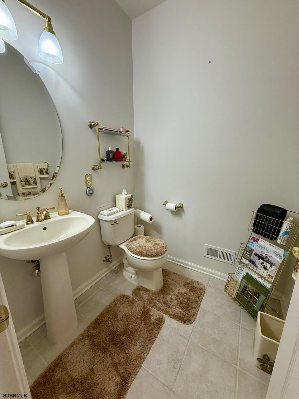 36 West Delray Lane Absecon, NJ 08201 - Photo 14 of 23 a bathroom with a sink toilet and a mirror