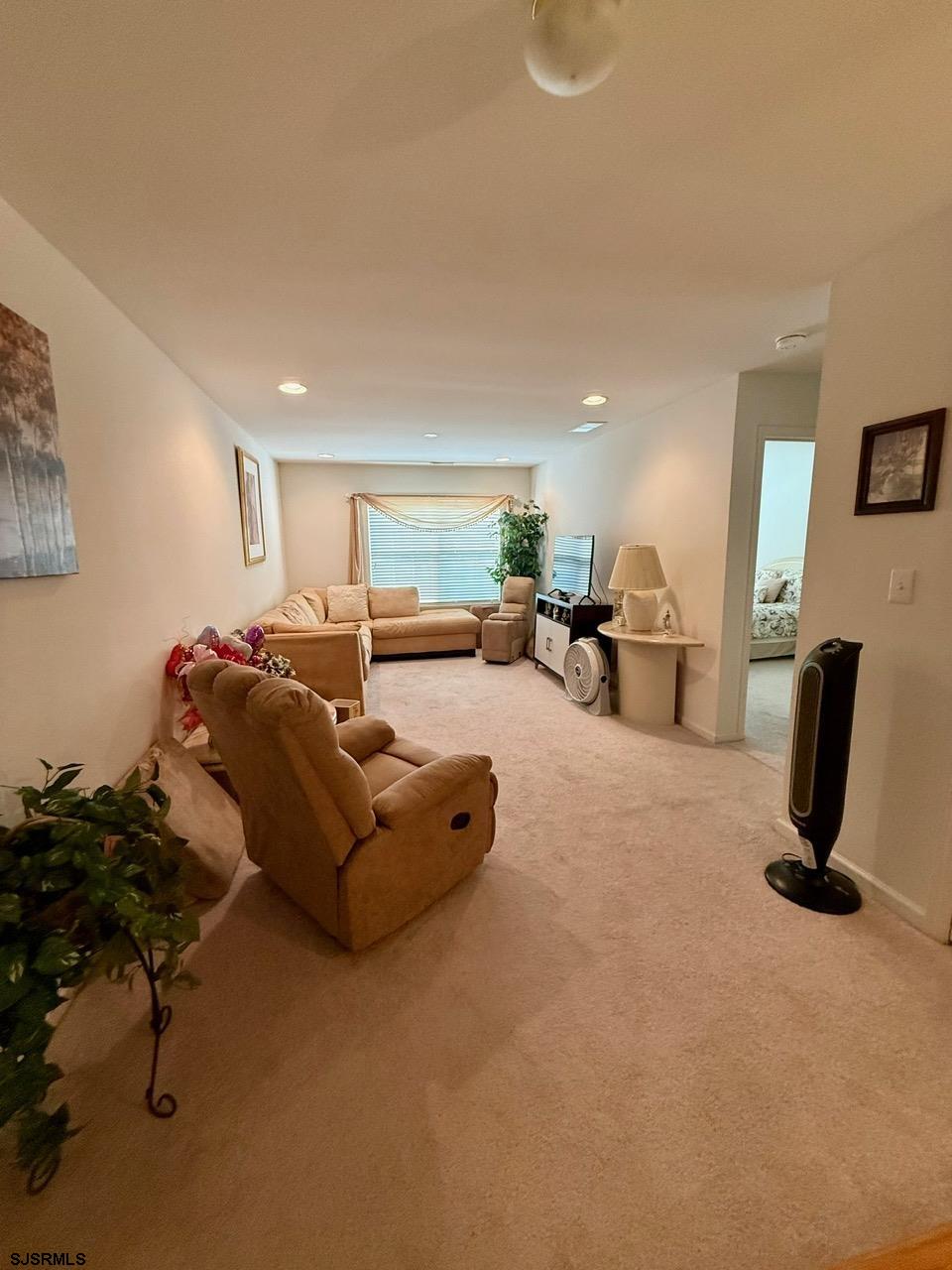 36 West Delray Lane Absecon, NJ 08201 - Photo 19 of 23 a living room with furniture gym equipment and a window