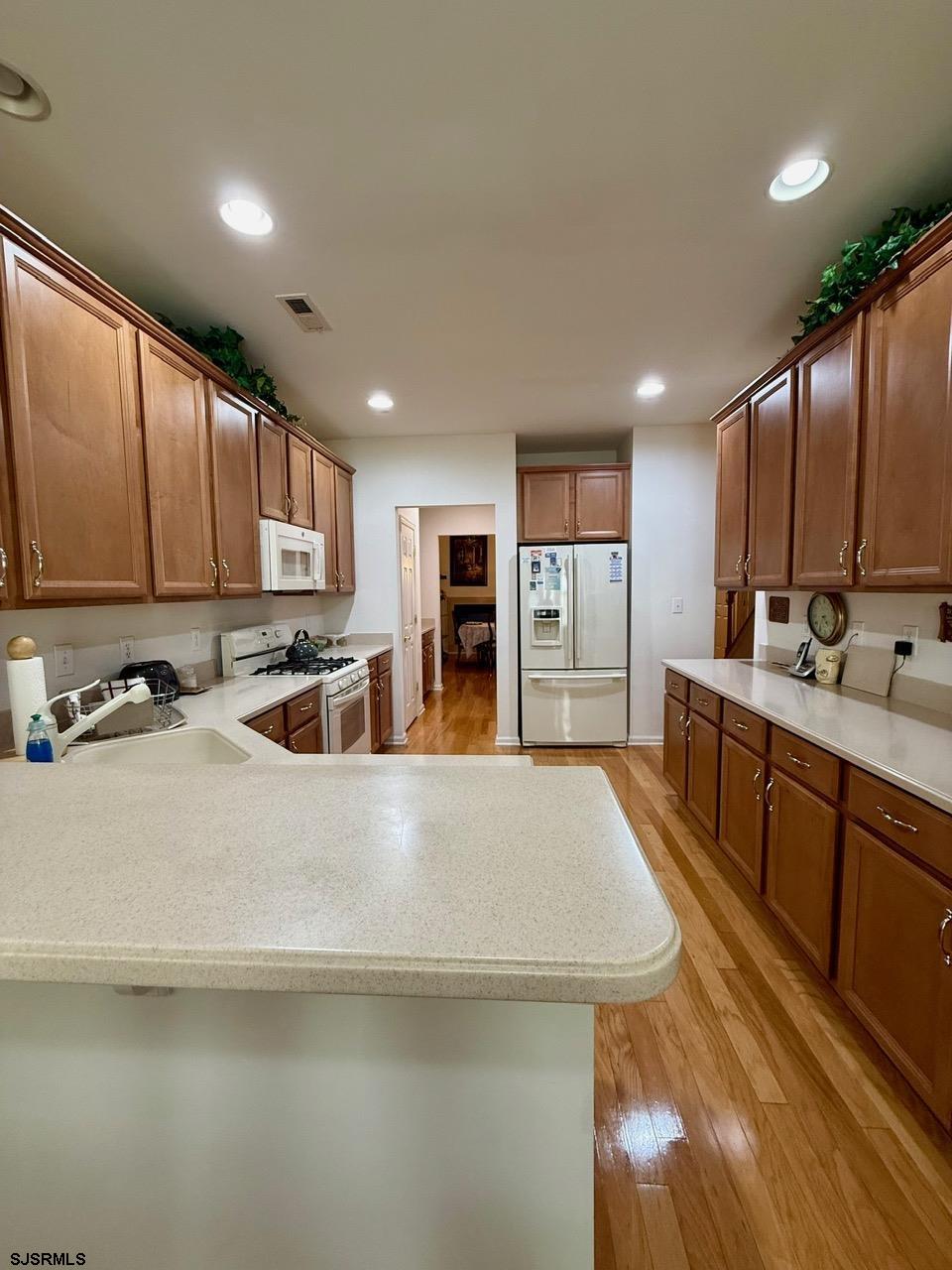36 West Delray Lane Absecon, NJ 08201 - Photo 7 of 23 a large kitchen with kitchen island a sink appliances and cabinets