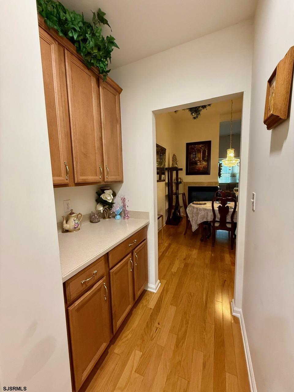36 West Delray Lane Absecon, NJ 08201 - Photo 8 of 23 a view of kitchen filled with furniture and wooden floor