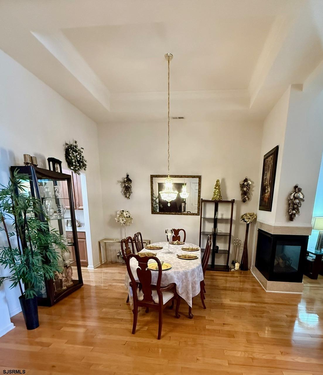 36 West Delray Lane Absecon, NJ 08201 - Photo 9 of 23 a living room with furniture a fireplace and a flat screen tv