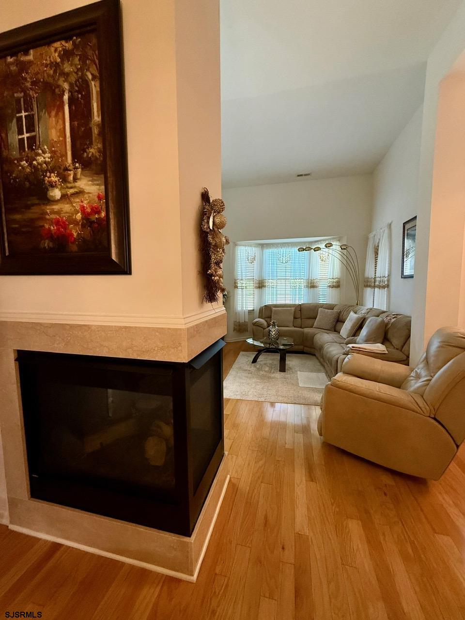 36 West Delray Lane Absecon, NJ 08201 - Photo 10 of 23 a living room with furniture and a fireplace