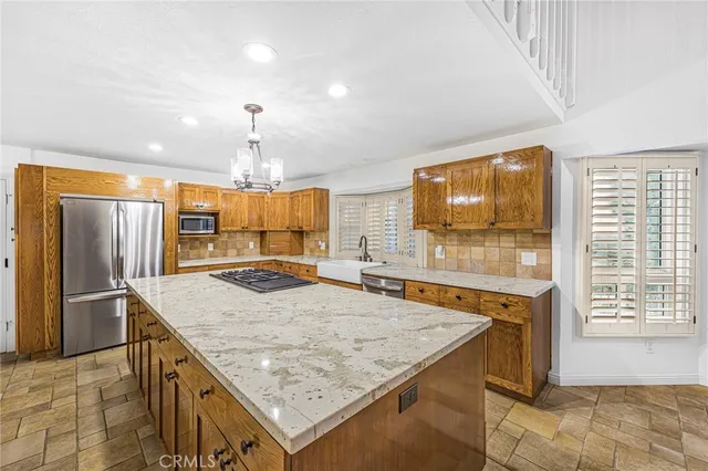 a bathroom with a granite countertop sink a mirror and a shower